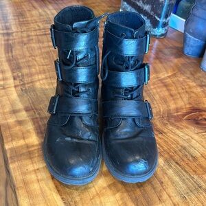 Black combat boots with straps
